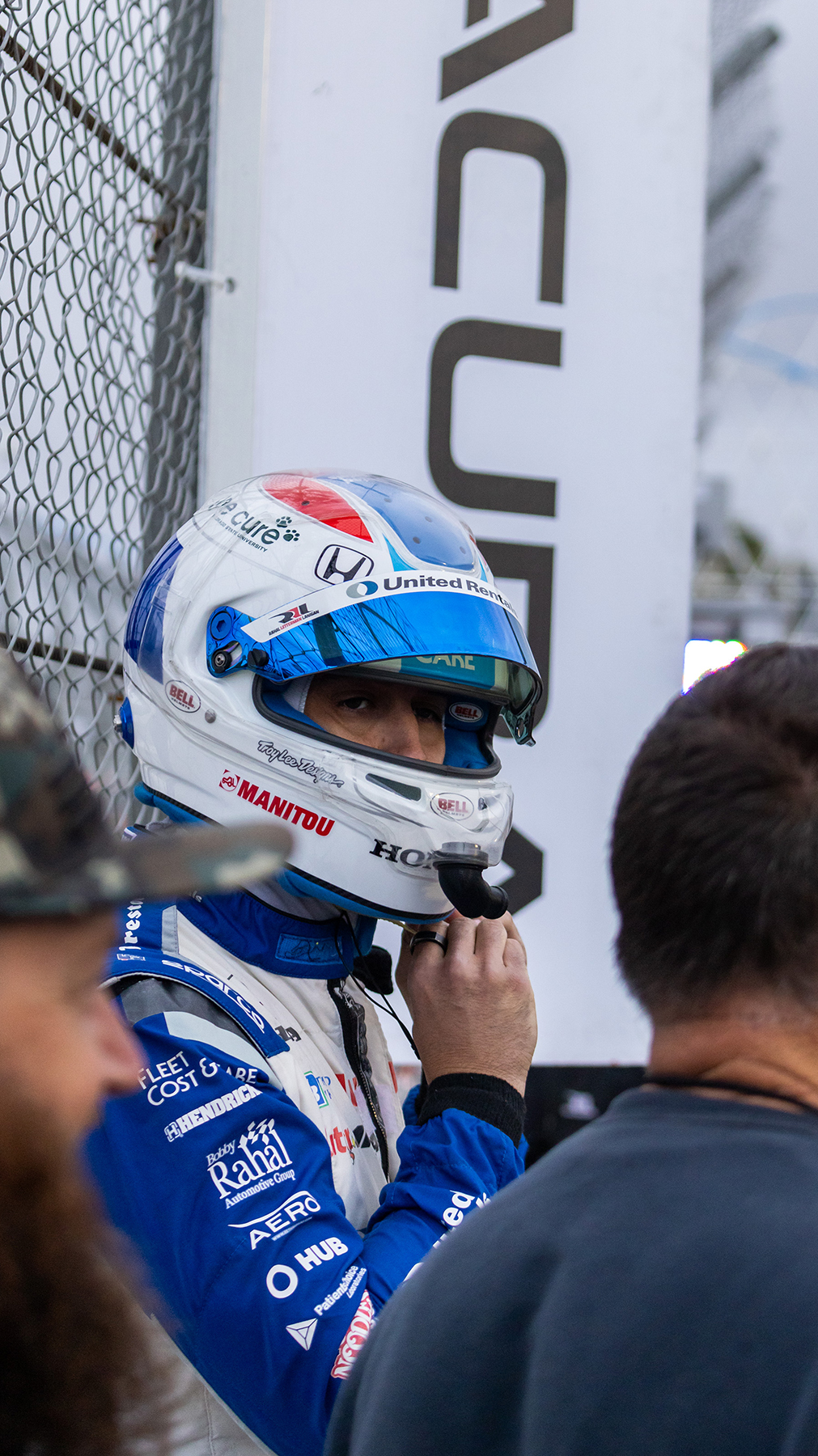 Graham Rahal straps on his helmet before participating in the IndyCar Series pit stop competitions during Thunder Thursday at the Pike Outlets.