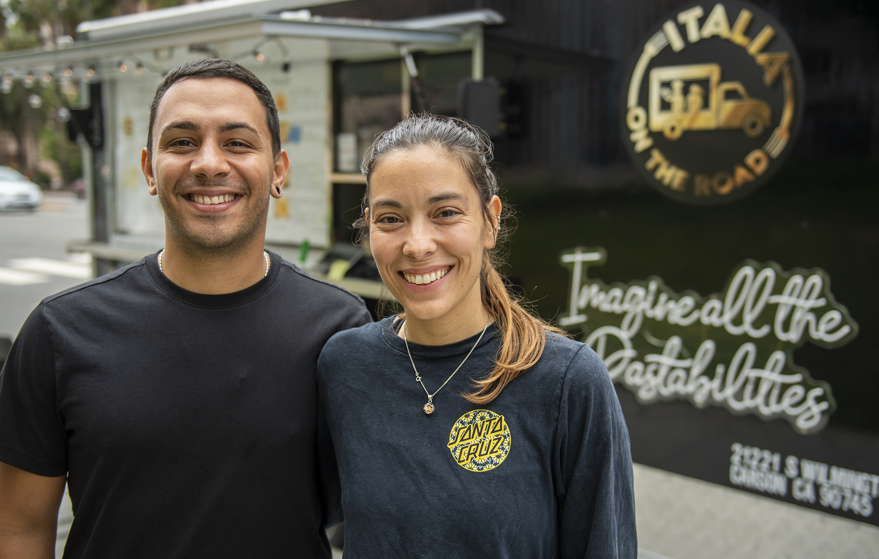Angelo Mazza and Solene Encinca stand in front of their food trailer, Italia on the Road.
