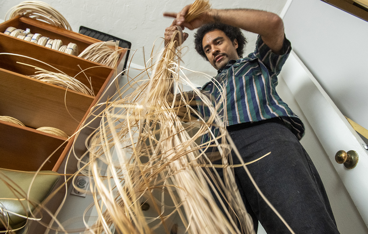 cane to use for a woven chair while working in his work studio.