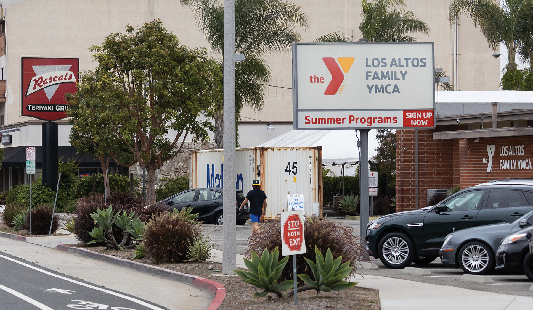 Two signs for a restaurant and YMCA facility.