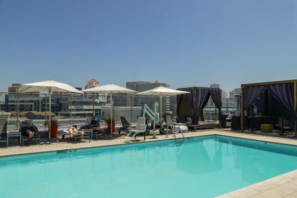 Guests sunbathe at the pool atop the Hyatt Centric at The Pike in Downtown Long Beach. 