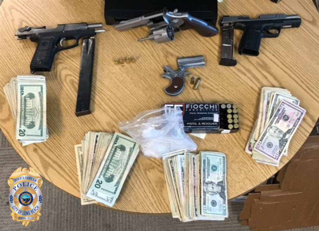 Gun and money seized during an illegal gambling raid on Wednesday Oct. 16, 2019. Photo courtesy Long Beach police.