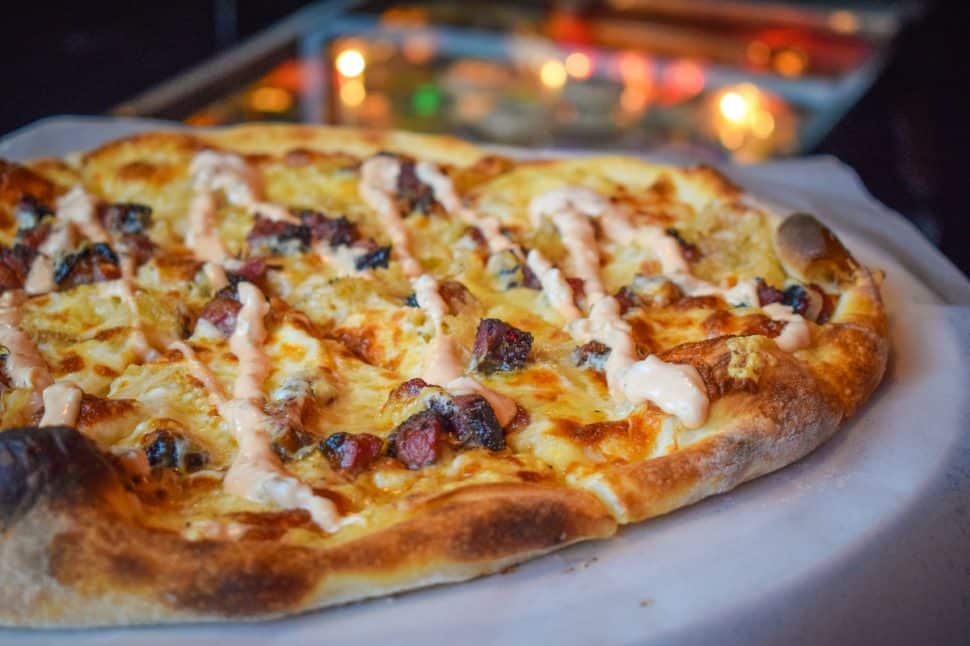 The Pastrami Dearest pizza at the 4th Horseman in Downtown Long Beach is a decadent wonder topped with chunks of pastrami, sauerkraut, and 1000 Island drizzle. Photo by Brian Addison.