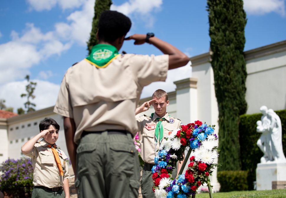 Boy Scouts from Troop #120 salute during the Placement of Memorial Wreath in memory of those who have served during the Forest Lawn Memorial Day event in Long Beach Monday, May 27, 2019. Photo by Kelly Smiley