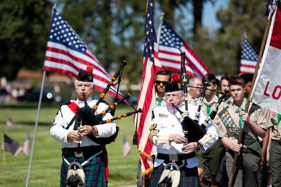 The 42nd Highlander Regimental Pipes and Drums and Boy Scouts of America, Troop #120 take part in the Memorial March in Long Beach Monday, May 27, 2019. Photo by Kelly Smiley